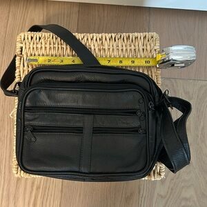Black leather crossbody bag unused, no brand tag. Gift brought back from Italy.